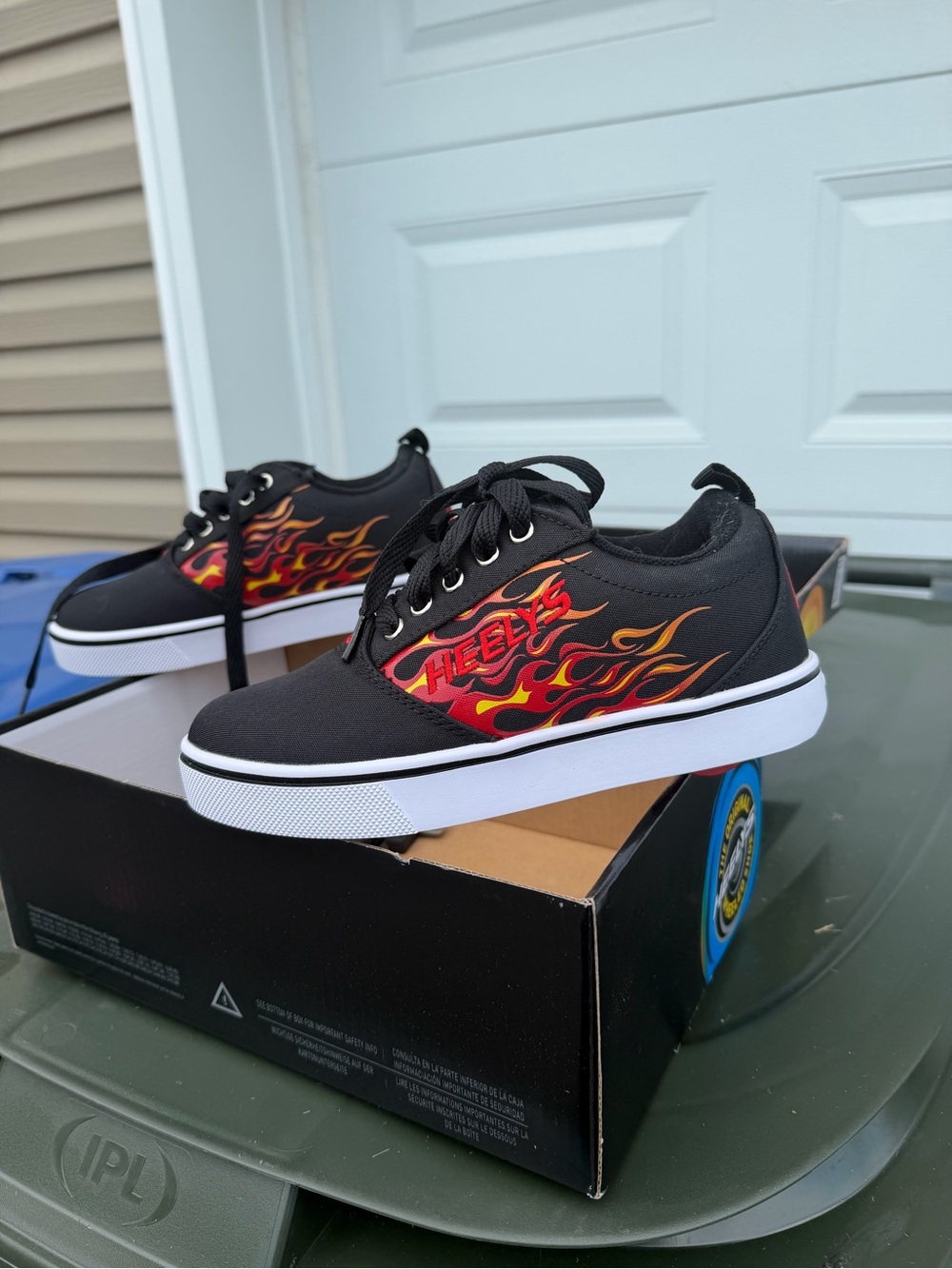 Heelys Kids Black Sneakers with Red and Orange Flame Accent